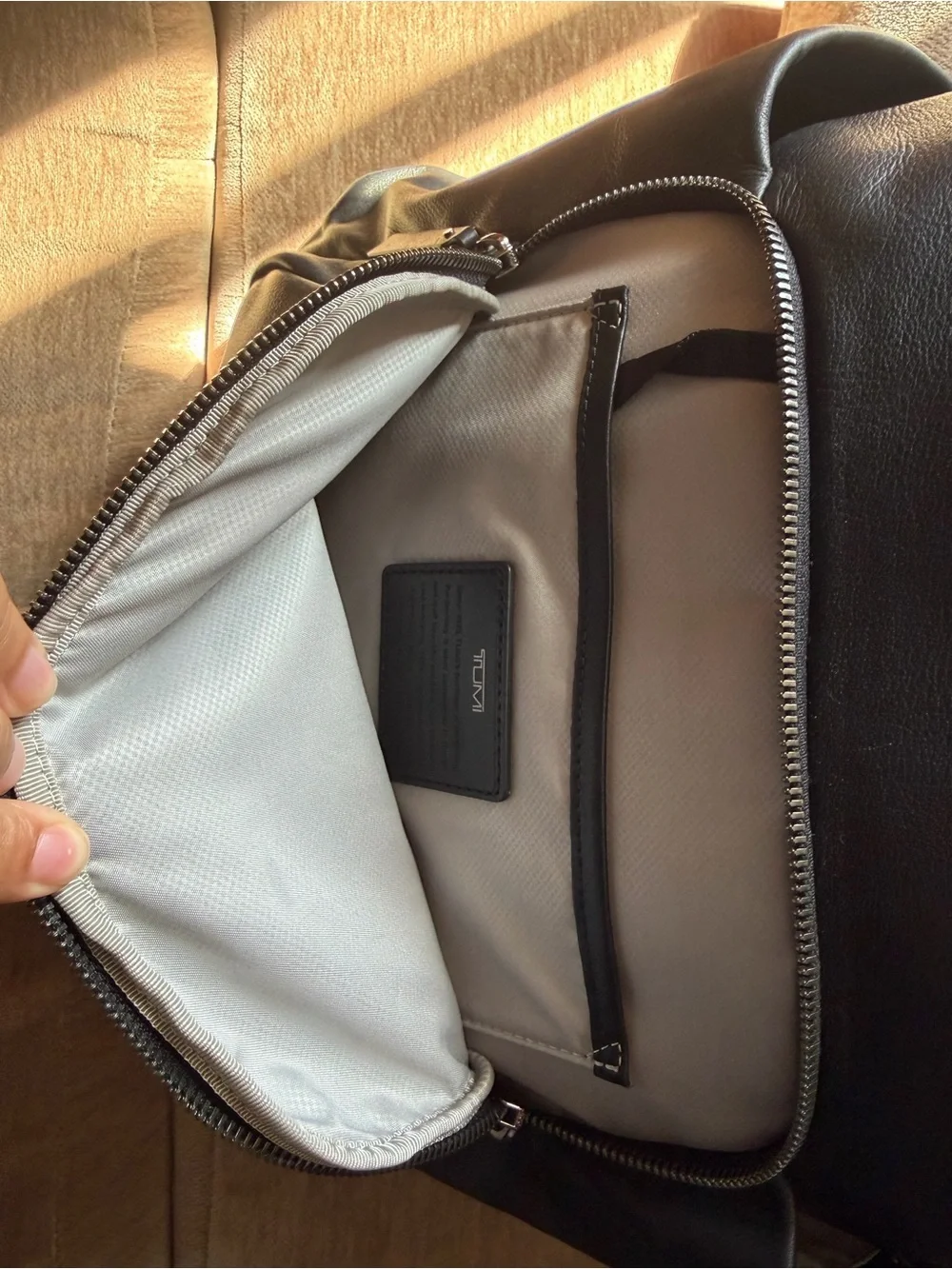 Tumi Black Leather Men's Backpack with Front Zip Pocket